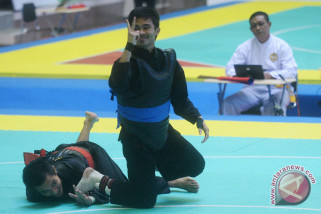 Taklukkan pesilat Laos, Abdul Malik Melangkah ke Final Taklukkan pesilat Laos, Abdul Malik Melangkah ke Final